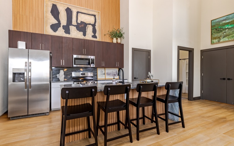 kitchen with island dining and stainless steel appliances