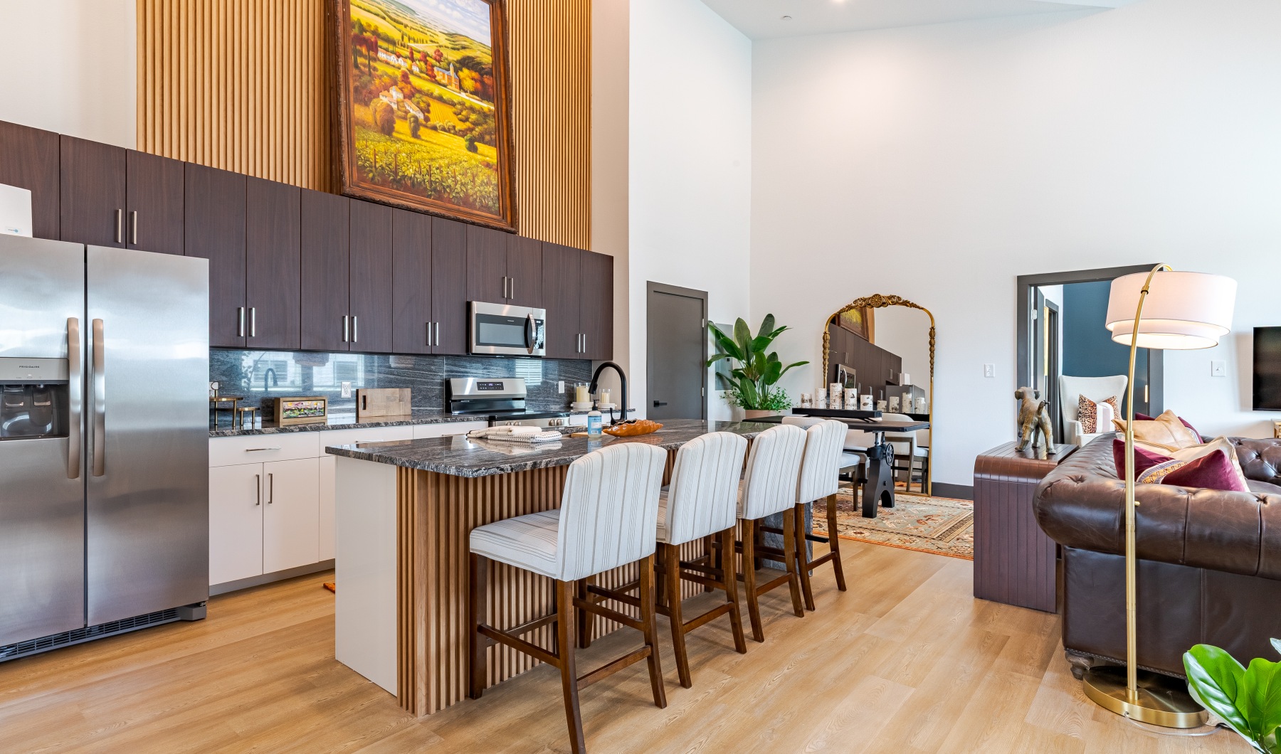 Settle into comfort at The Villas on Turtle Creek kitchen with island and stainless steel appliances